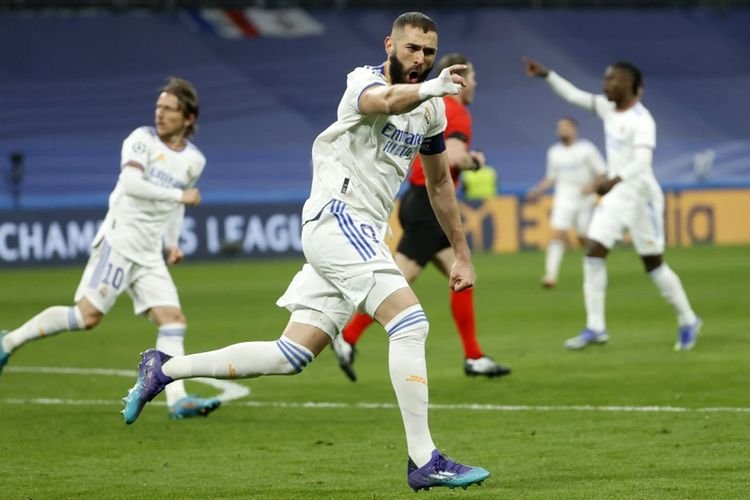 Striker Real Madrid Karim Benzema merayakan gol yang dicetaknya ke gawang Paris Saint-Germain di laga Liga Champions. (Foto: olenas.id/thesun.co.uk)